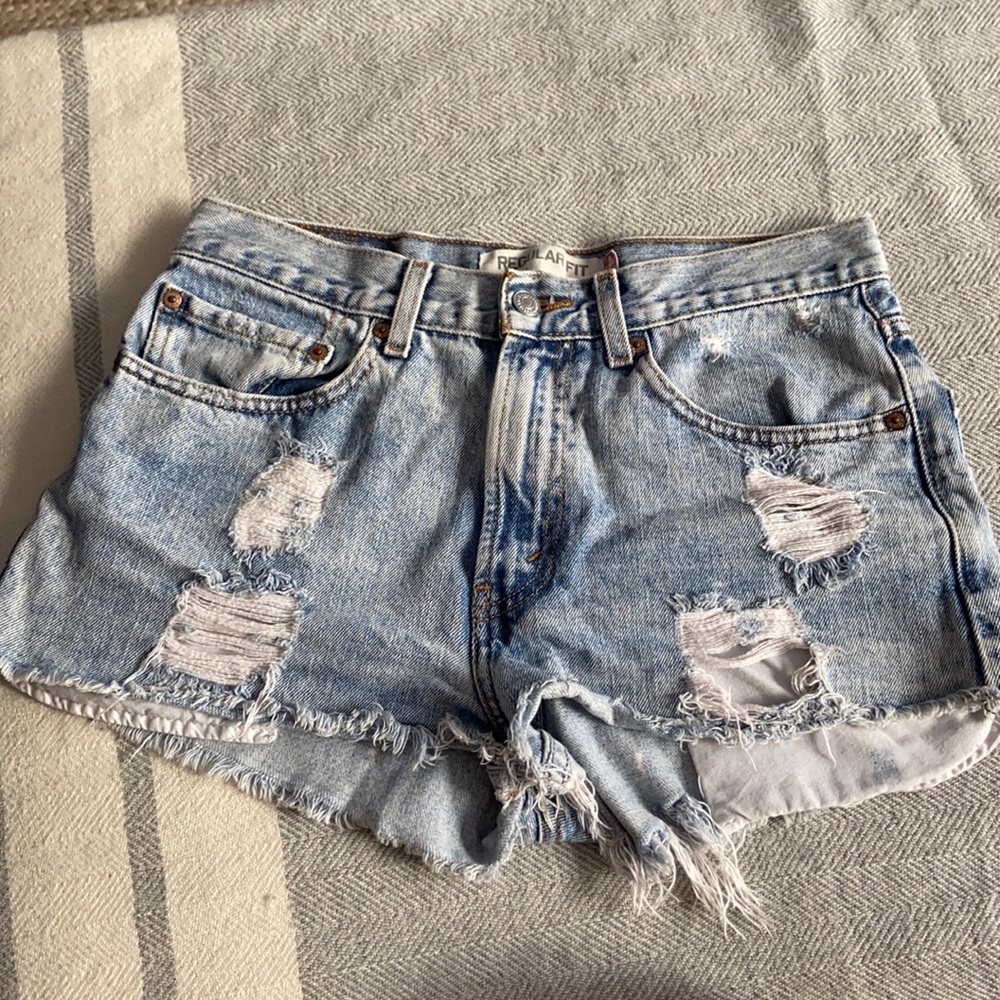 High-waist vintage distressed denim Levi’s